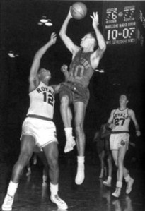   Stokes defends against the New York Knicks’ Mel Hutchins during a game in 1958.  Jack Twyman is trailing the play (Courtesy of Jay Twyman). 