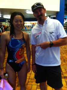 Sean Anthony enjoys a smile with swimmer Natsumi Hoshi, bronze medalist in the 200-meter butterfly at the 2012 London Olympics. Hoshi is wearing a swimsuit featuring a design of Italian swimmer Federica Pellegrini, who has also spent a lot of time training in Flagstaff over the years. 　COURTESY PHOTO